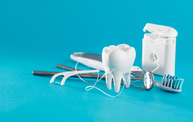 dental floss, a tooth, toothbrush, and other dental suppliers