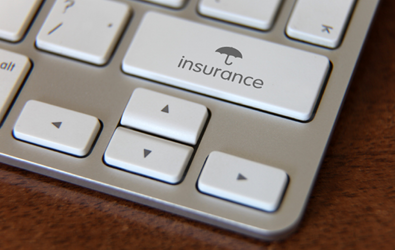 right corner of a keyboard shown with the word insurance and an umbrella icon in the place of a key