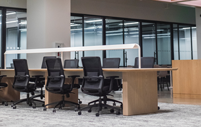 large office table with office chairs in office space