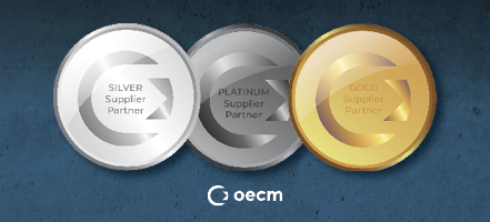 Overlapping silver, platinum and gold medals that include the OECM logo in the center along with the label that includes the colour and words supplier partner