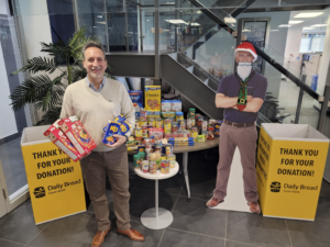 Jim Hadjiyianni, Director, Business Development stops by to drop his contribution into the Daily Bread Food Bank bins at the OECM office