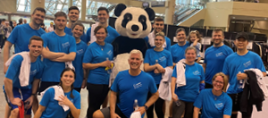 OECM staff standing with a Panda to raise funds for WWF at the CN Tower Climb