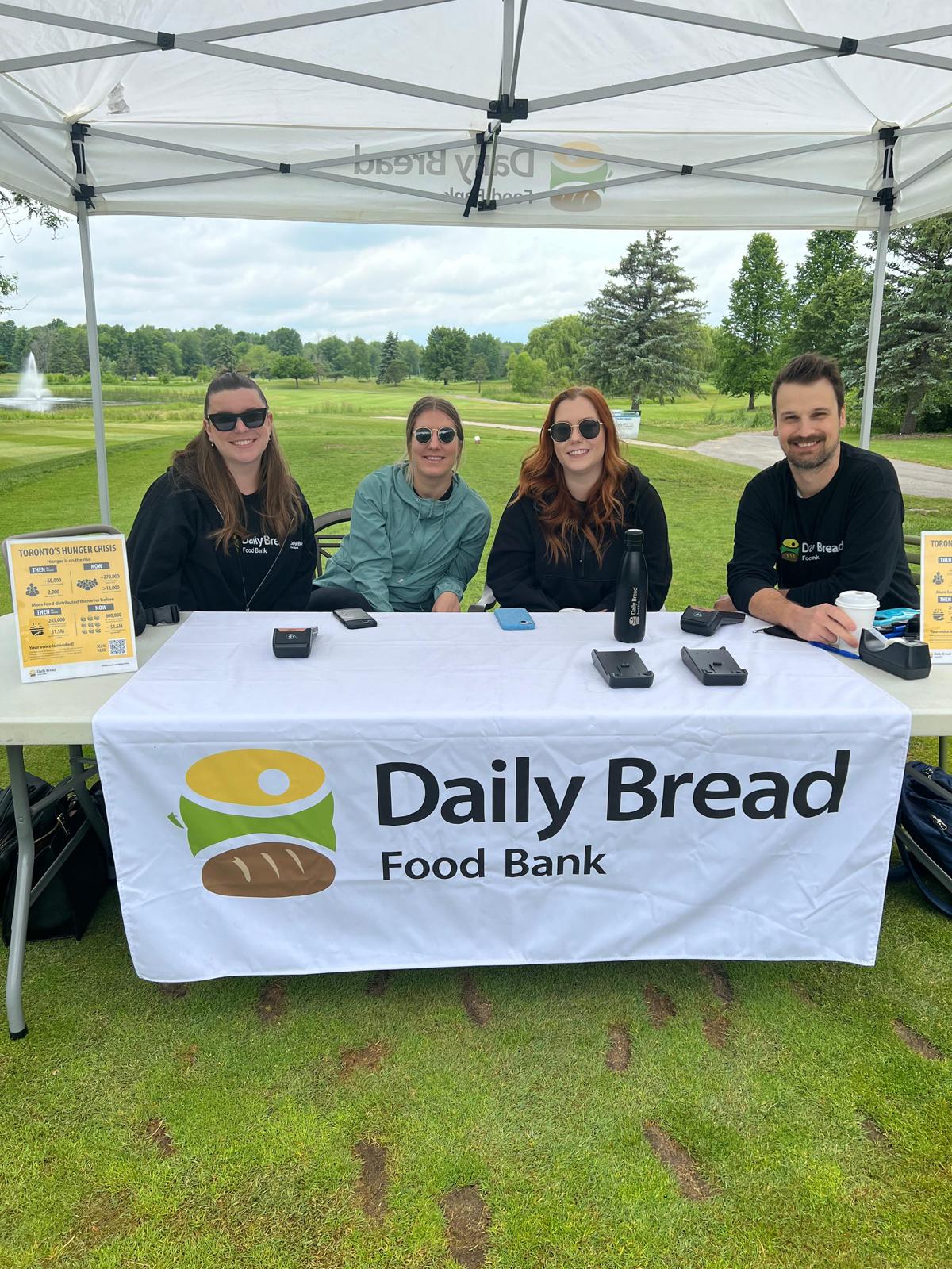 Staff members from the Daily Bread Food Bank set up a fundraising booth at the Golf Tournament