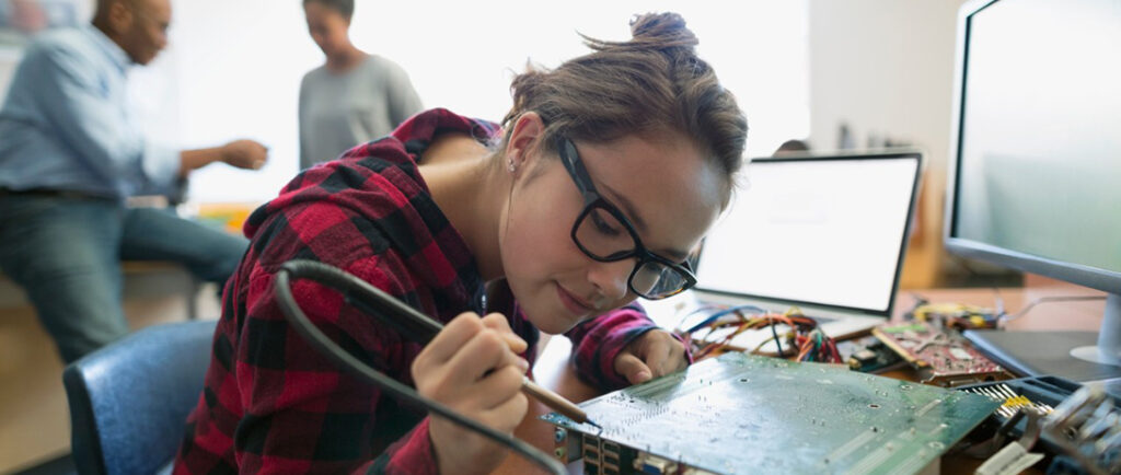 girl working on a motherboard