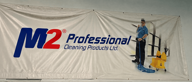 M2 Professional Cleaning Products Ltd. wall banner featuring a cleaner with mop and bucket