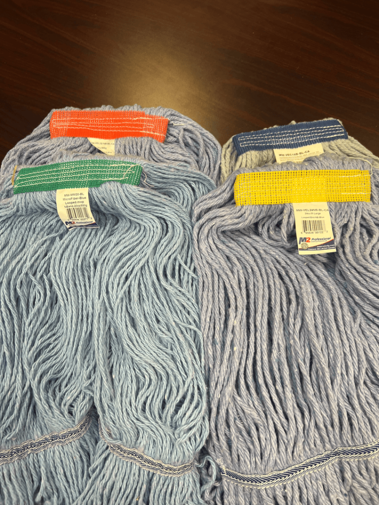 Colour-coded M2 Professional loop-end mops for commercial cleaning use