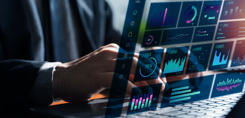 Professional using AI-powered analytics dashboard on a laptop to analyze business data.