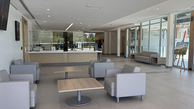 Town Hall lobby with public seating, reception desk and floor-to-ceiling windows.