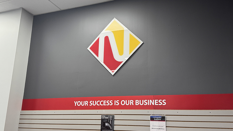Noble logo and “Your Success Is Our Business” signage inside the Vaughan facility.